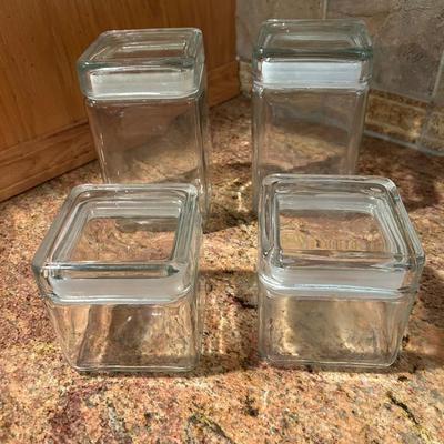 Four Glass Canisters 