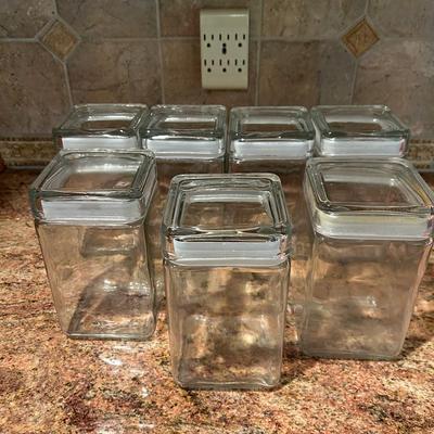 Seven Large Glass Canisters