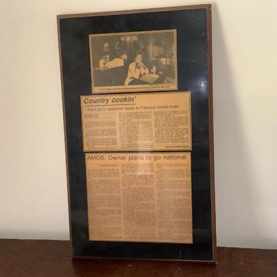 Plaque with news article about Famous Amos