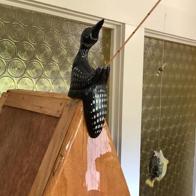 And hand carved bird fishing
