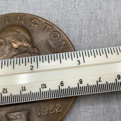 3 inch diameter, solid bronze. Weighs 8 oz