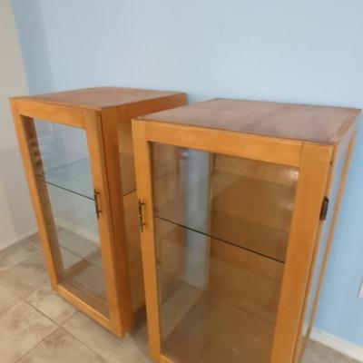 2 Curio Cabinets On Wheels With Glass Front & Shelves