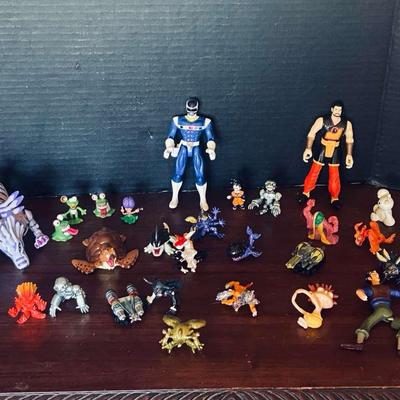 Assorted Lot Of Action Figures- Digivolving Garurumon, Digimon Birdramon, The Shadow and More…