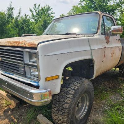 84’ White Square body Chevy truck, 4-wheel Drive. 