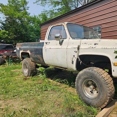 84’ White Square body Chevy truck, 4-wheel Drive. 