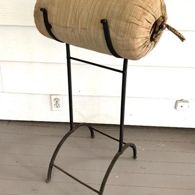 This is an antique large Bobbin lace making bolster pillow with hand forged wrought iron stand. I’m guessing late 19 th c.. I see this...