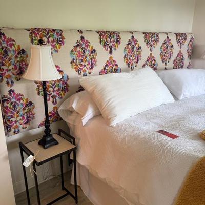 Upholstered king size headboard, pair of iron tables and lamps