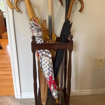 Vintage Umbrella stand with umbrellas and Canes (online)