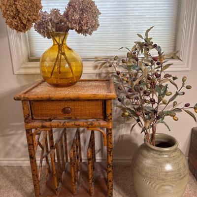 Wicker Side Table and Floral Decor (online) 