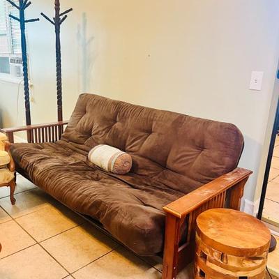 Modern futon in a Chestnut color with a wooden frame 
