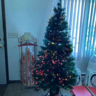 Wooden sled. Fiber optic tree