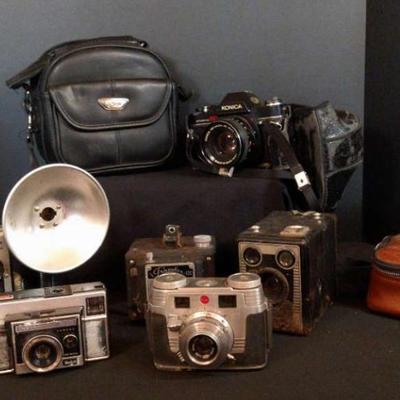 Vintage camera collection with cases and accessories