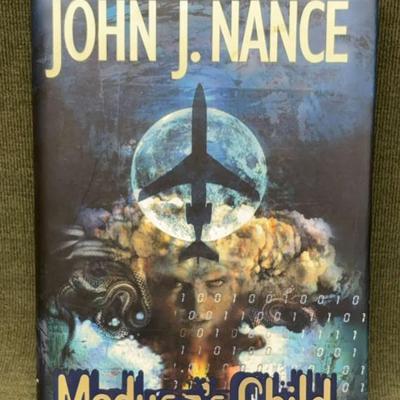 Signed medusa's child" by john j. nance