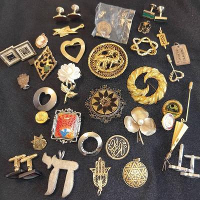 Assortment Of Gold And Silver Toned Pins, Pendants, And Cufflinks
