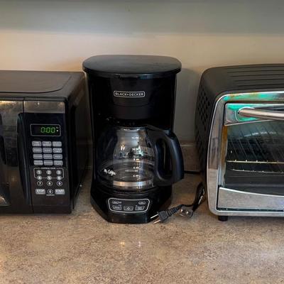 Walmart Microwave Oven, Black And Decker, Coffee Maker, And An Oster Toaster Oven