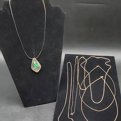 (1) Sterling Pendant And (6) Sterling Chains 