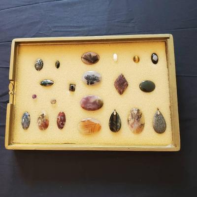 Display Case with Decorative, Polished Stones for Pendants