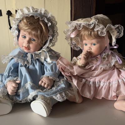 Two Porcelain-Head Victorian-Style Dolls