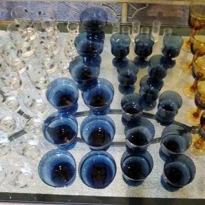 Vintage collector glasses and goblets, blue, amber, and clear