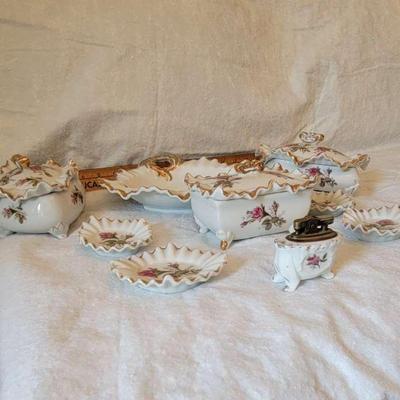 Decorative fine china ashtrays and candy and/or cigarette boxes.
