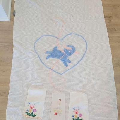 Vintage assorted linens including chenille baby blanket and tea towels.