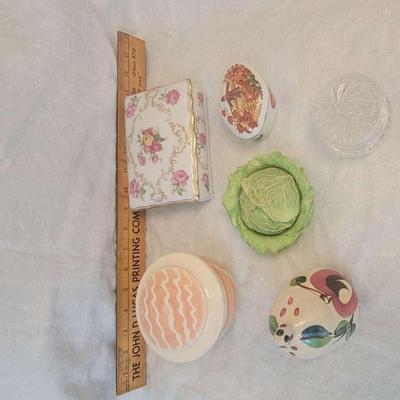 Assorted decor including music box and containers