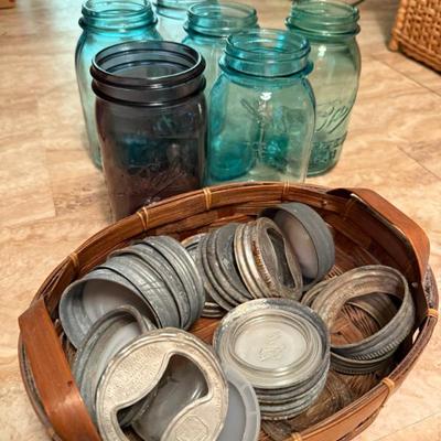 Example of canning jars and lids: White, green, purple, and blue glass jars with zinc/metal and ceramic/glass lids