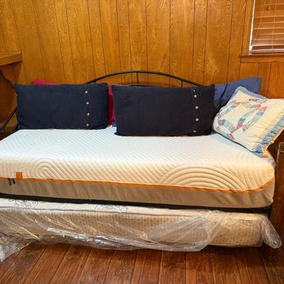 Trundle bed – 2 twin beds, makes king when lower bed pulled out. With bed shirt and pillows makes cute sofa/day bed