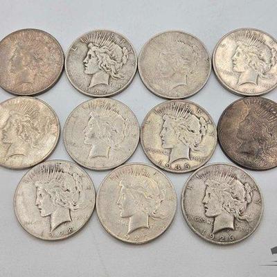 #1403 • (11) 1923-1935 Mint Silver Peace Dollars
