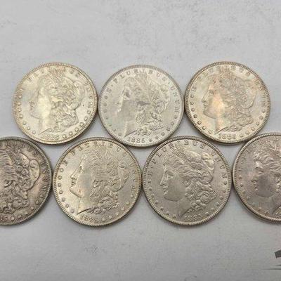 #1358 • (7) 1885 Philadelphia Morgan Silver Dollars
