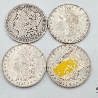 #1318 • (4) 1884 Morgan Silver Dollars
