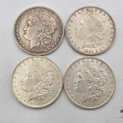 #1320 • (4) 1884 New Orleans Morgan Silver Dollars
