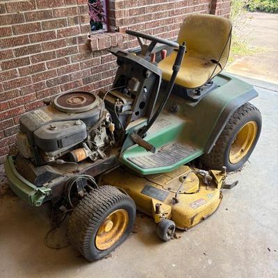 As is; mechanical condition unknown.  I think the top may be in the detached garage for this mower.