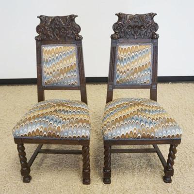 1251	PAIR OF CARVED OAK CHAIRS WITH UPHOLSTERED SEATS AND BACK CHAIR CREST CARVED WITH FALCON HEADS AND BARLEY TWIST LEGS, EACH...