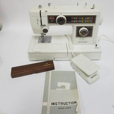 1103	DRESS MAKERS SEWING MACHINE MODEL GLOZFA, APPROXIMATELY 12 IN X 7 IN X 12 IN HIGH
