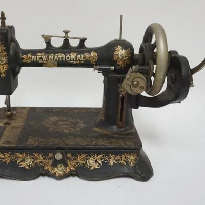 1096	ANTIQUE NEW NATIONAL CAST IRON SEWING MACHINE, APPROXIMATELY 13 IN X 9 IN X 11 IN HIGH
