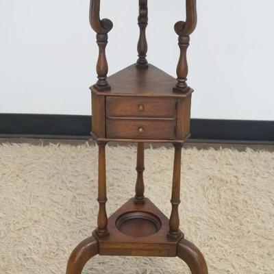 1242	BAKER FURNITURE MAHOGANY PLANT STAND WITH BRASS LINER AND 1 DOOR COMPARTMENT CENTER, APPROXIMATELY 12 IN X 33 IN H
