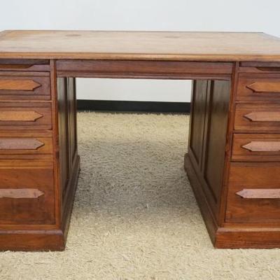 1275	CHESTNUT 8 DRAWER DESK WITH PULL OUT SURFACES AND PANELED SIDES, APPROXIMATELY 54 IN X 33 IN X 31 IN H
