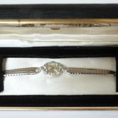 1167	JULES JURGENSEN 14K WHITE GOLD AND 10 DIAMOND COUNTESS LADIES WATCH IN ORIGNAL PACKAGING, 10.4DWT
