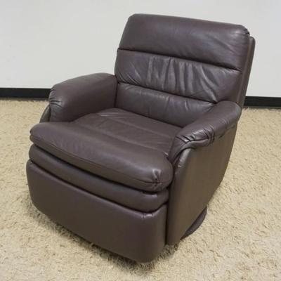 1241A	BARACALOUNGER, BROWN LEATHER SWIVEL RECLINER WITH EXTENDING HEAD REST, APPROXIMATELY 32 IN X 34 IN X 31 IN H
