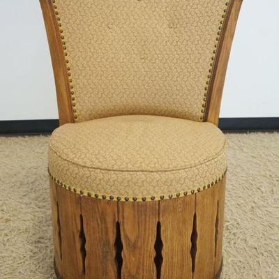 1232	RANCH OAK REVOLVING UPHOLSTERED BARREL CHAIR WITH BRASS TACKING ACCENTS, APPROXIMATELY 28 IN X 23 IN X 40 IN H
