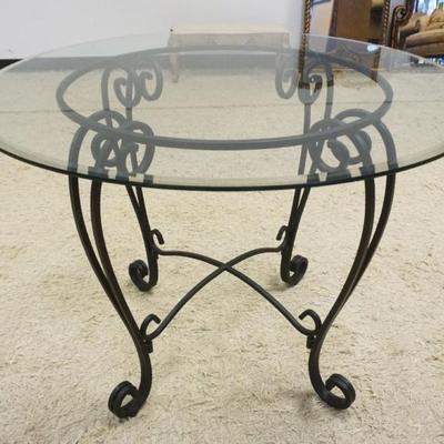 1238	GLASS TOP BEVELED EDGE TABLE WITH WROUGHT IRON BASE, APPROXIMATELY 42 IN X 30 IN H
