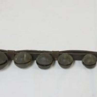 1071	BRASS SLEIGH BELLS, 12 MOUNTED ON LEATHER STRAP, LARGEST APPROXIMATELY 3 IN
