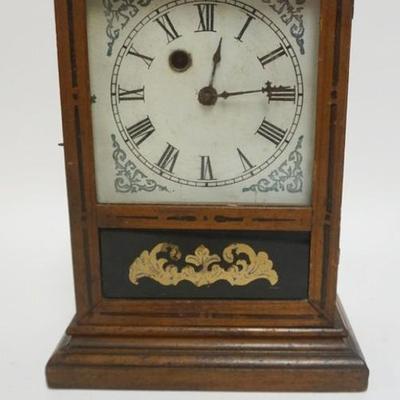 1110	ANTIQUE SHELF CLOCK WITH LOWER REVERSED GLASS PAINTED DOOR, APPROXIMATELY 6 IN X 4 IN X 11 IN H
