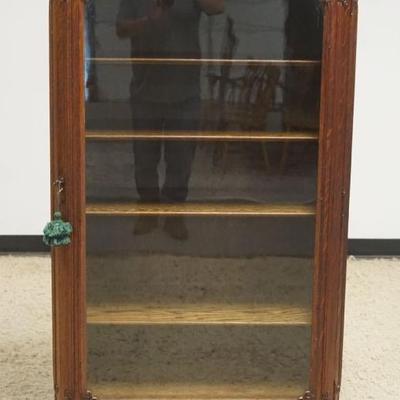 1257	NICE SAGINAW OAK BOOKCASE WITH CURVED SIDES AND APPLIED CARVINGS, APPROXIMATELY 32 IN X 15 IN X 59 IN H
