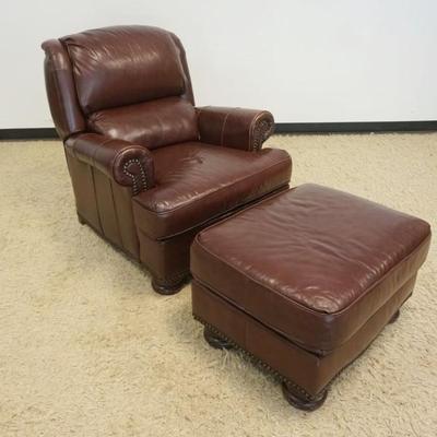 1198	BRADINGTON YOUNG LEATHER RECLINING CHAIR AND OTTOMAN, EACH HAVING BRASS TACK ACCENTS, CHAIR APPROXIMATELY 36 IN X 37 IN X 40 IN H,...