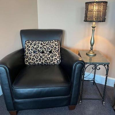 Black chair with table lamp