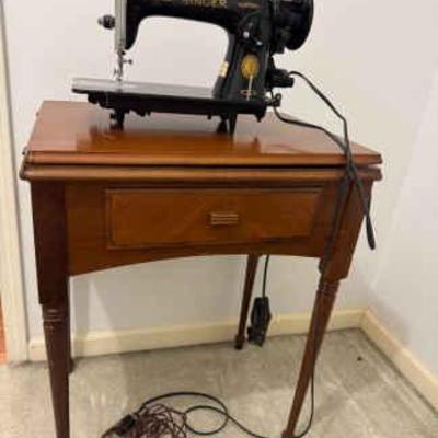 Singer sewing with table