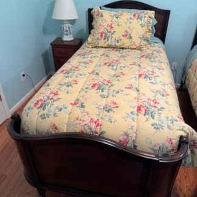 Twin bed with side table lamp