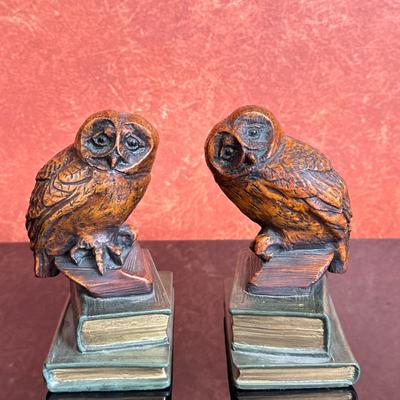 (2pc) Bookends - Owls | Pair of painted resin bookends, each featuring a wide-eyed owl perched atop a stack of books. After a similar...